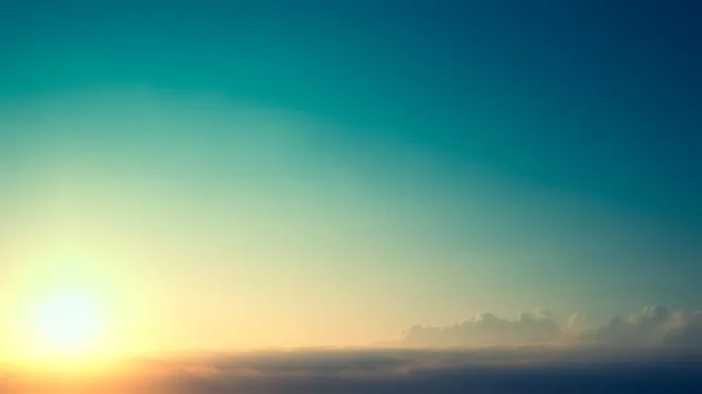 Sun rising over clouds in a teal sky