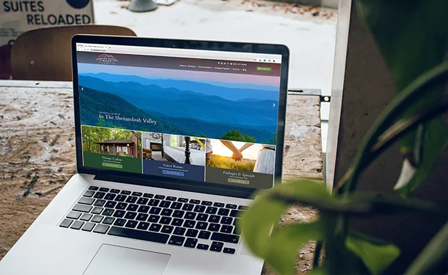Laptop showing a Logan Marketing hotel website design